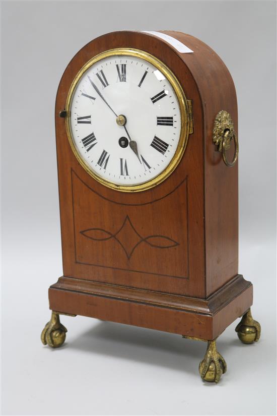 An inlaid mahogany mantel timepiece